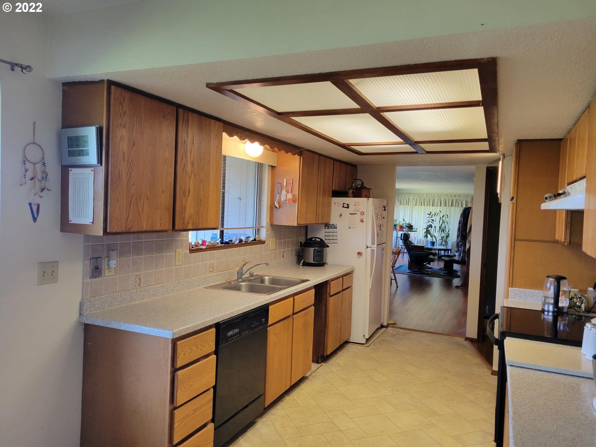 752 Cooper Creek Road Sutherlin, OR 97479 - Photo 5 of 10 a kitchen with a sink cabinets and window