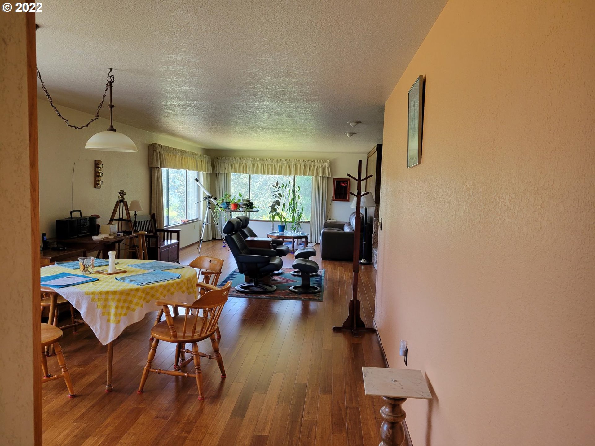 752 Cooper Creek Road Sutherlin, OR 97479 - Photo 7 of 10 a view of a dining room with furniture and a chandelier