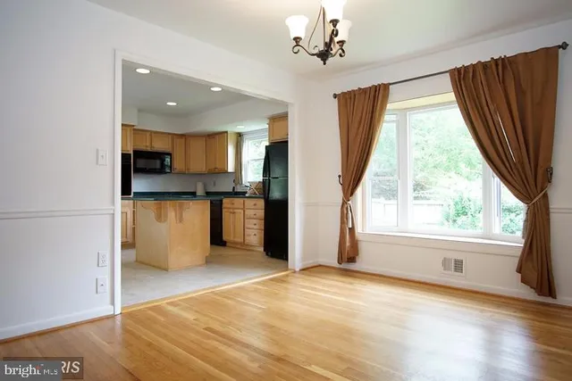 a view of a kitchen with a sink and a window