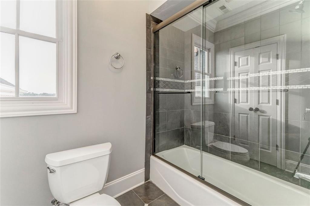 311 Langston Road Southeast Calhoun, GA 30701 - Photo 11 of 100 a bathroom with a shower and toilet