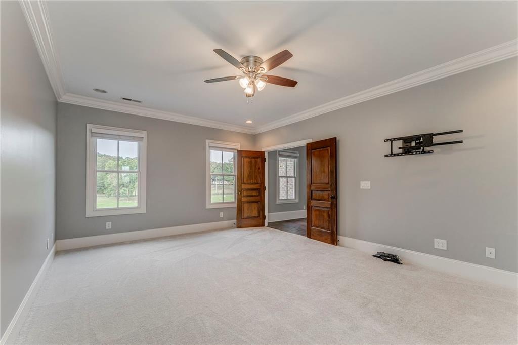 311 Langston Road Southeast Calhoun, GA 30701 - Photo 27 of 100 a view of a livingroom with a ceiling fan and window
