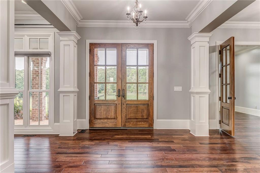 311 Langston Road Southeast Calhoun, GA 30701 - Photo 52 of 100 a view of empty room with wooden floor and fan