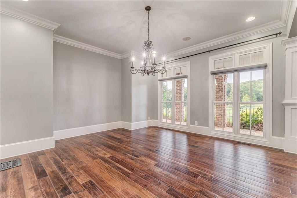 311 Langston Road Southeast Calhoun, GA 30701 - Photo 56 of 100 a view of an empty room with wooden floor and a window