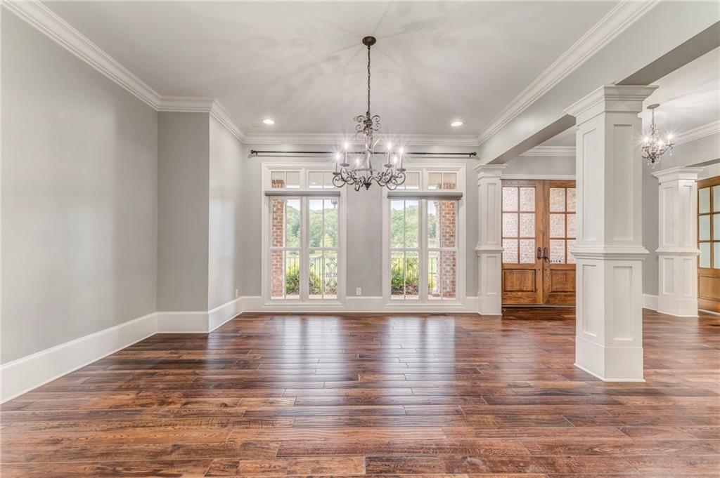 311 Langston Road Southeast Calhoun, GA 30701 - Photo 57 of 100 a view of an empty room with wooden floor and a window