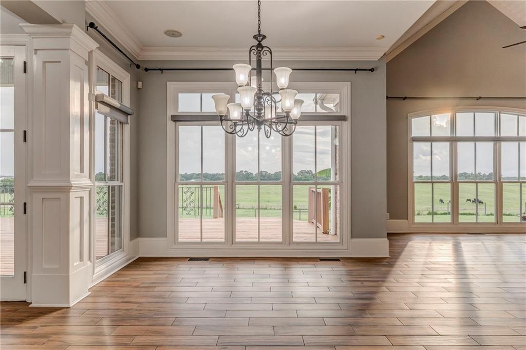 311 Langston Road Southeast Calhoun, GA 30701 - Photo 68 of 100 a view of an empty room with wooden floor and a window