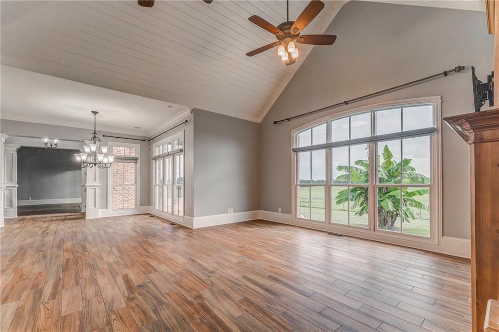 311 Langston Road Southeast Calhoun, GA 30701 - Photo 74 of 100 a view of an empty room with wooden floor and a window