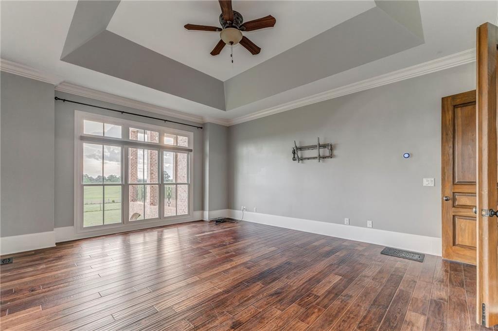 311 Langston Road Southeast Calhoun, GA 30701 - Photo 84 of 100 wooden floor in an empty room with a window