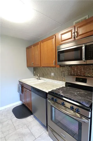 a kitchen with a stove and a microwave