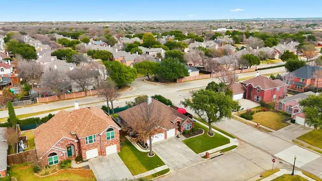 an aerial view of a house with a garden