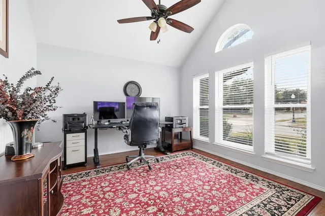 a living room with furniture rug and a window