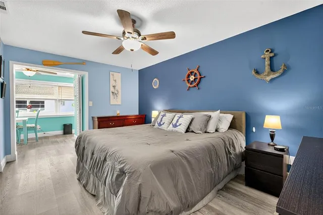 a bedroom with a bed and lamps