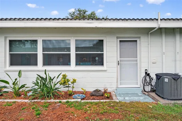 a view of a swimming pool with a chairs