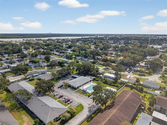 a living room with furniture and a book shelf