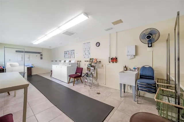 an aerial view of residential houses with outdoor space and river