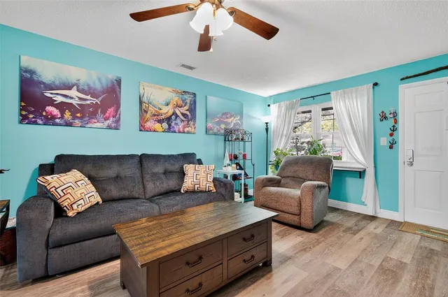 a living room with furniture and a window