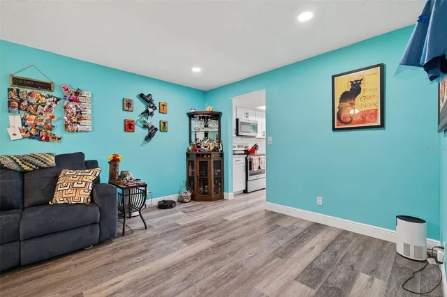 a kitchen with a refrigerator and a sink