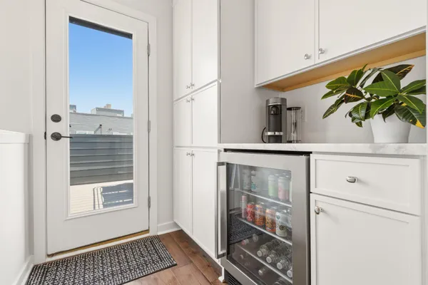 a kitchen with a refrigerator and a stove