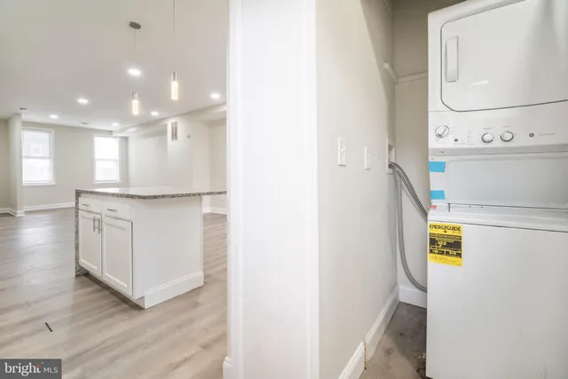 a view of a kitchen from the hallway