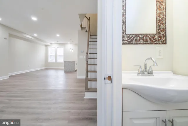 a bathroom with a sink and mirror