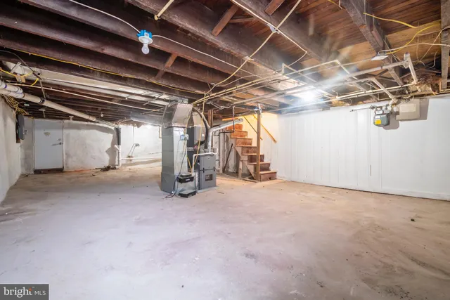 a view of empty room with wooden ceiling
