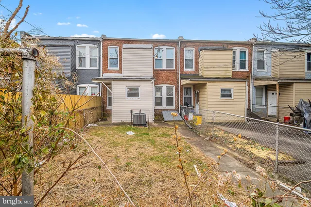 a view of a house with snow on the road