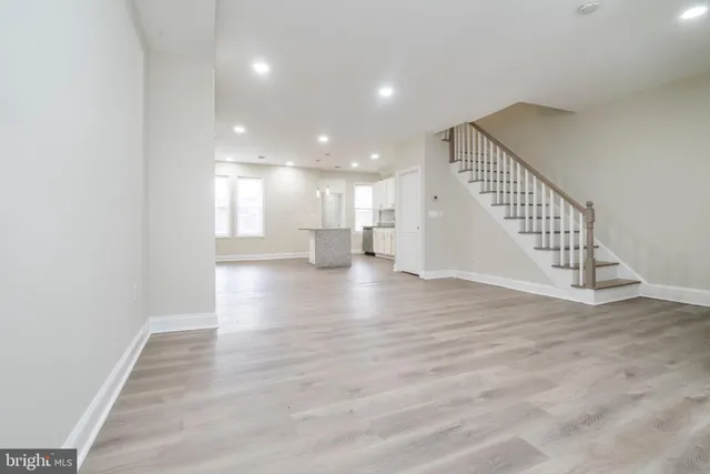 a view of an entryway with wooden floor