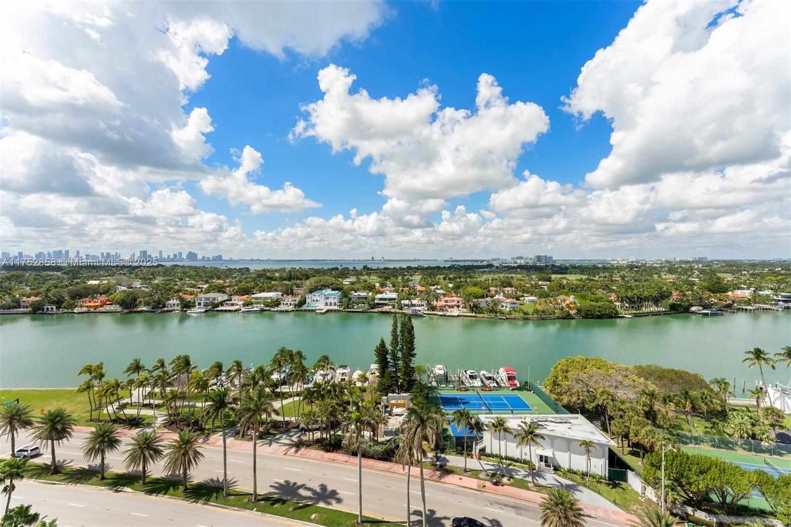 5401 Collins Avenue, Unit 1220 Miami Beach, FL 33140 - Photo 12 of 13 a view of a lake with a table and chairs