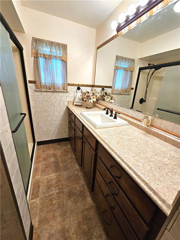 45 Mounts Road Washington, PA 15301 - Photo 17 of 33 a bathroom with a sink a vanity and mirror