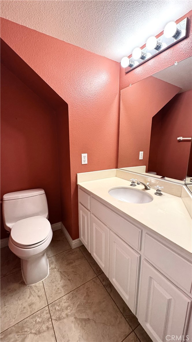 16208 Peppertree Lane La Mirada, CA 90638 - Photo 38 of 75 a bathroom with a sink toilet and vanity