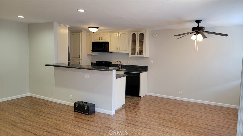 5403 Newcastle Avenue, Unit 12 Encino, CA 91316 - Photo 13 of 26 a view of a kitchen with a sink and wooden floor