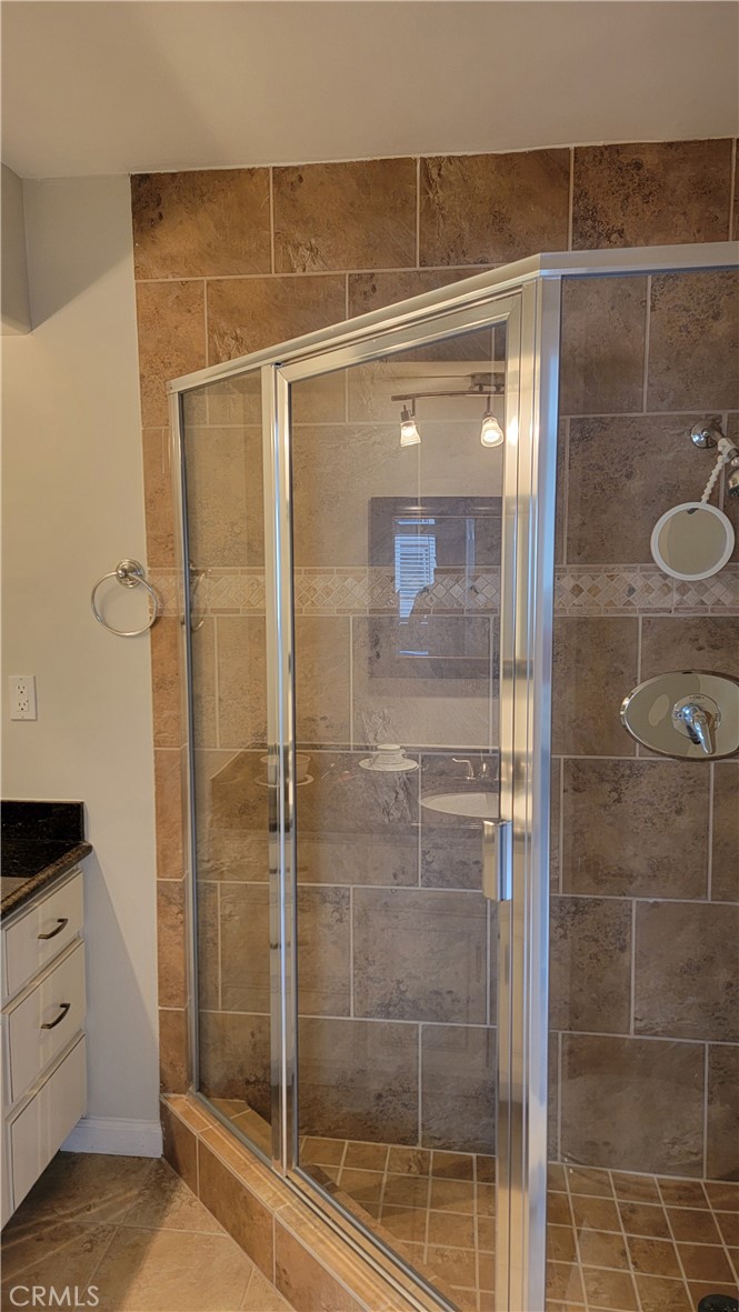 5403 Newcastle Avenue, Unit 12 Encino, CA 91316 - Photo 20 of 26 a bathroom with a shower