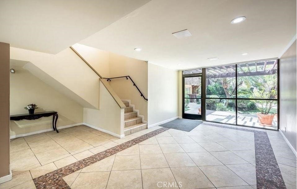 5403 Newcastle Avenue, Unit 12 Encino, CA 91316 - Photo 6 of 26 a view of an empty room and windows