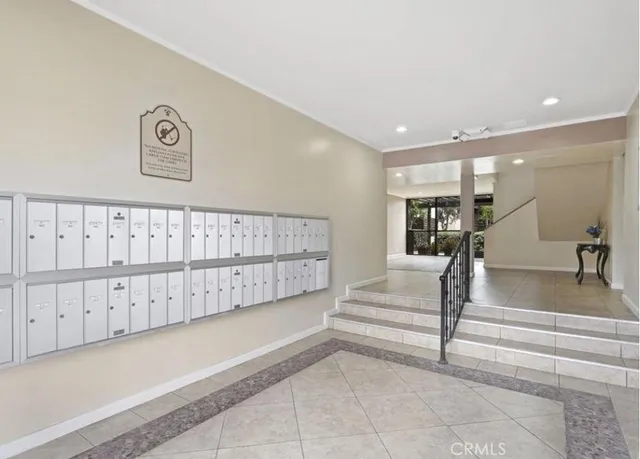 a utility room with cabinets washer and dryer