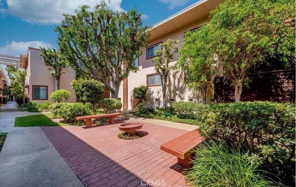 5403 Newcastle Avenue, Unit 12 Encino, CA 91316 - Photo 9 of 26 a view of a house with backyard and garden