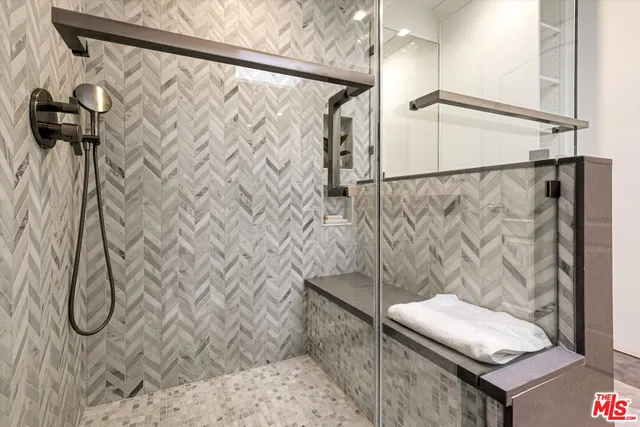 a bathroom with a shower curtain and a sink