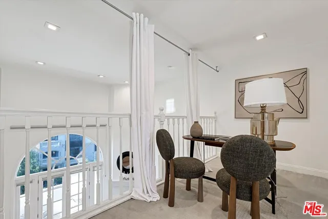 a bedroom with furniture and a window