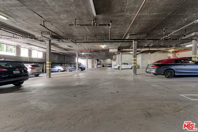 a view of parking garage with cars