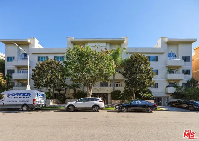 a view of street with parked cars