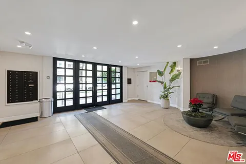 a view of an empty room with a potted plant
