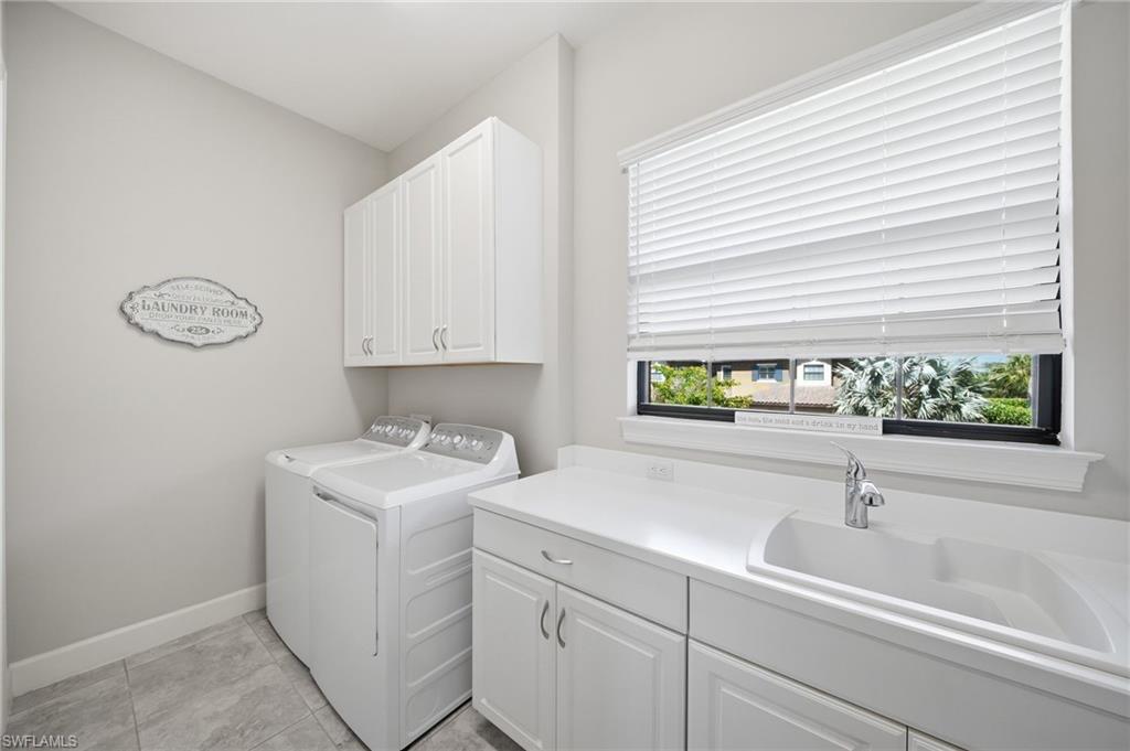 9658 Montelanico Loop, Unit 201 Naples, FL 34119 - Photo 23 of 46 a bathroom with a sink and a bathtub
