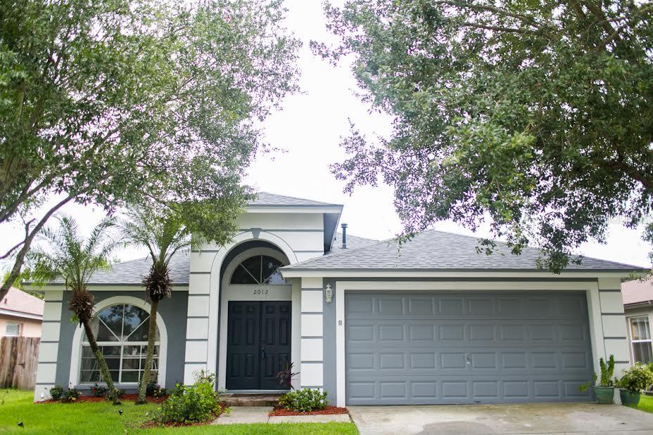 2012 Bridgehampton Place Brandon, FL 33511 - Photo 1 of 1 a front view of a house with garden