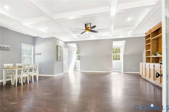 a view of a livingroom with furniture window and wooden floor