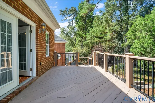 a view of a balcony with wooden floor