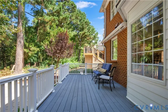 a view of a deck with a table and chairs