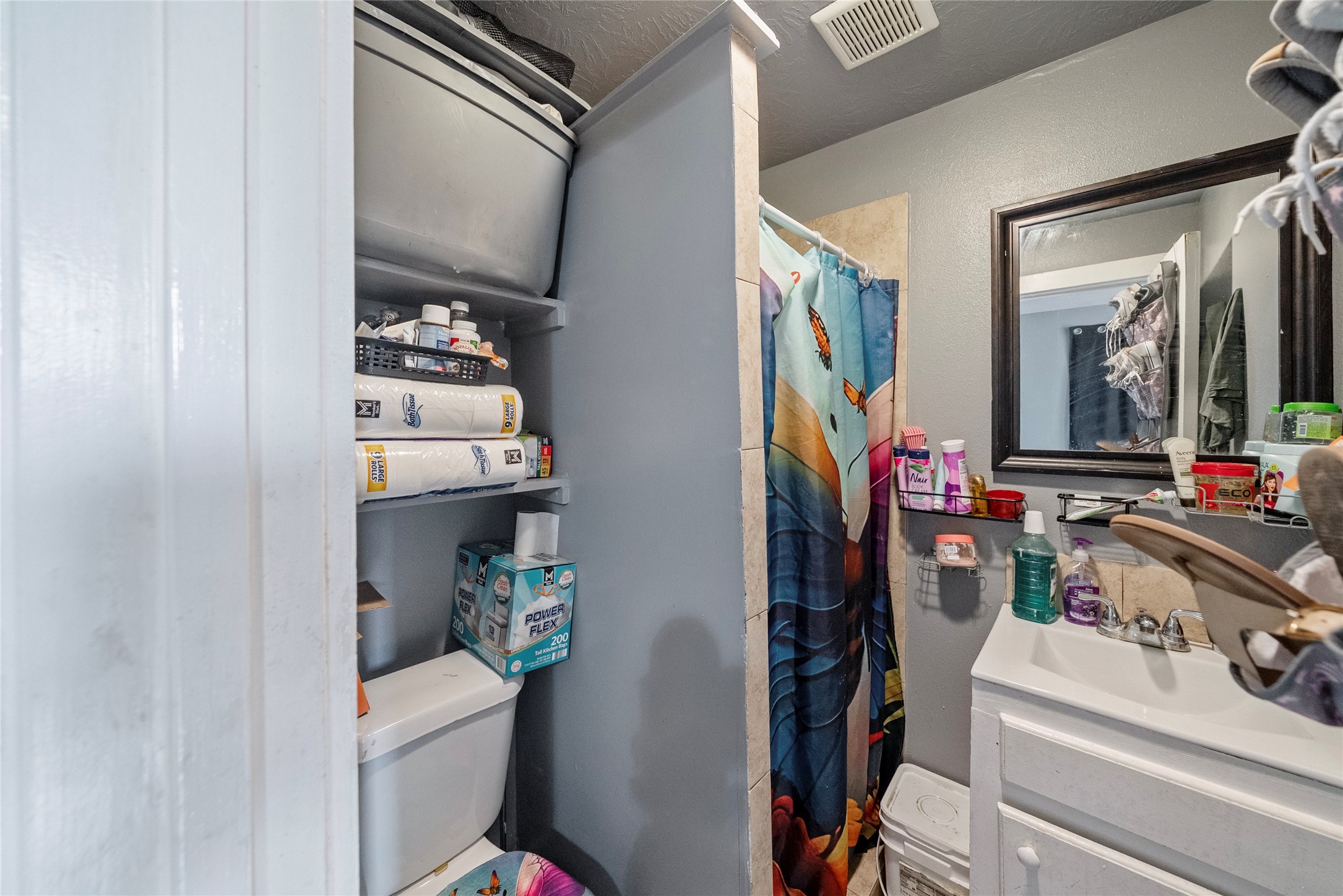 7938 Kerr Street, Unit 6 Houston, TX 77029 - Photo 16 of 18 a view of walk in closet with clothes and shoes