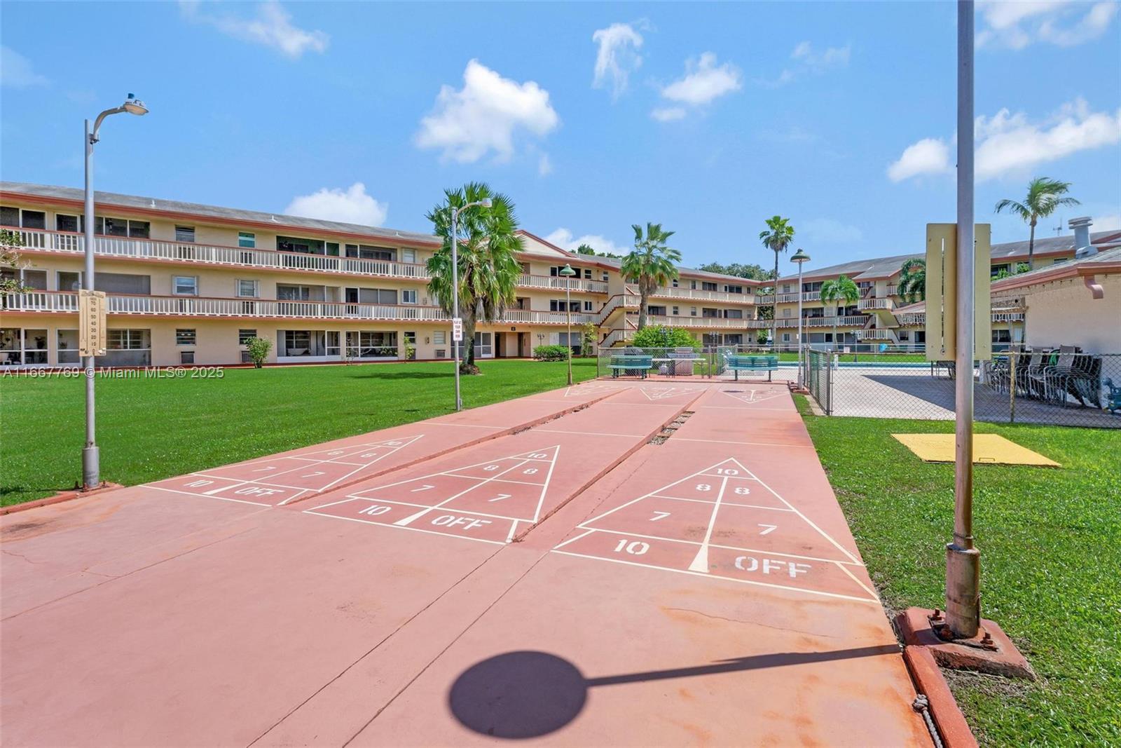 5300 Washington Street, Unit C111 Hollywood, FL 33021 - Photo 23 of 40 a view of a backyard with a garden and plants