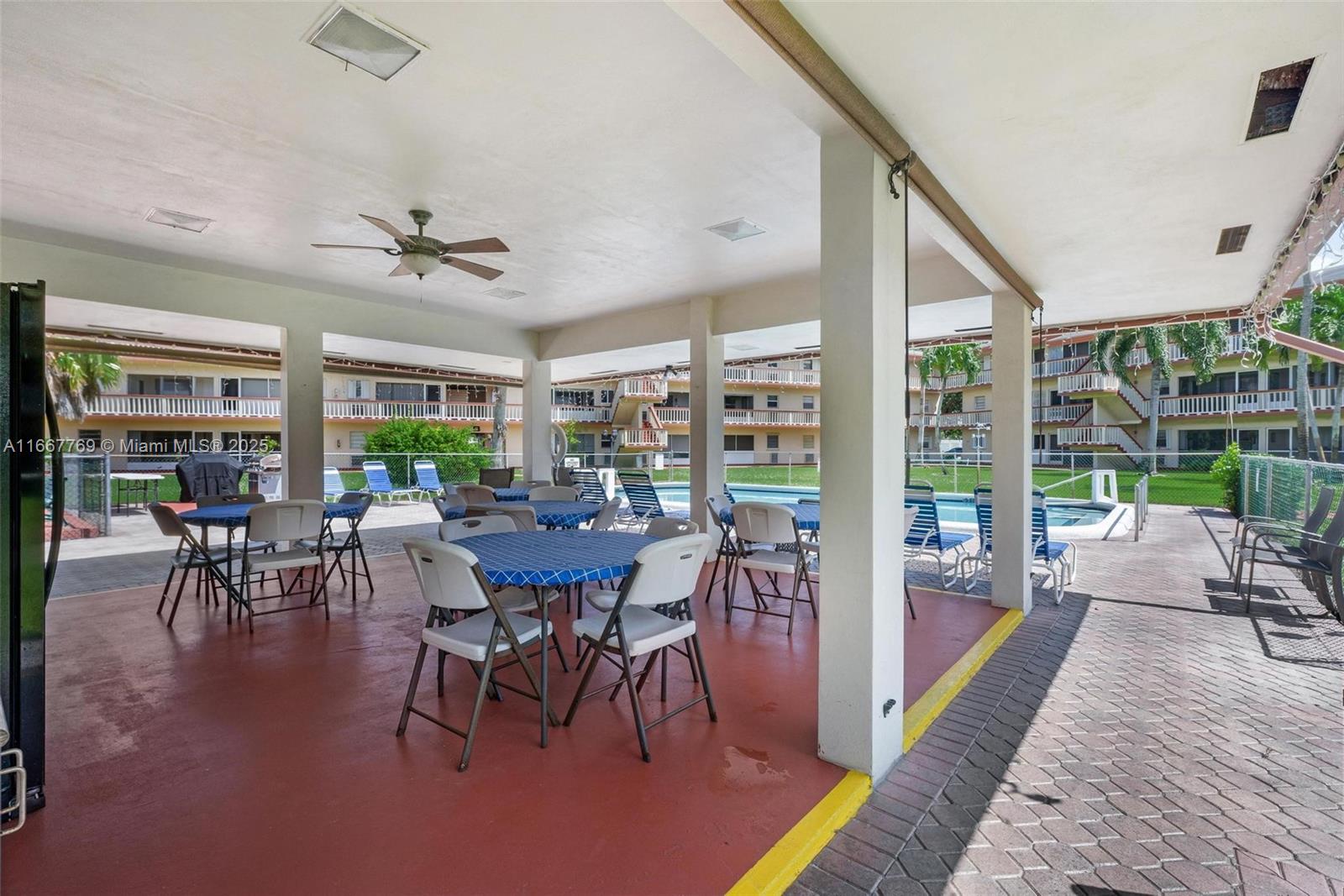 5300 Washington Street, Unit C111 Hollywood, FL 33021 - Photo 24 of 40 a view of a dining room with furniture window and wooden floor
