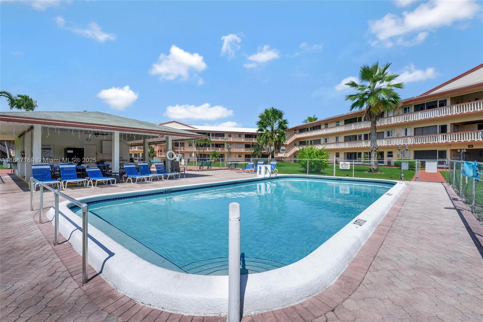 5300 Washington Street, Unit C111 Hollywood, FL 33021 - Photo 27 of 40 a view of a swimming pool with a patio