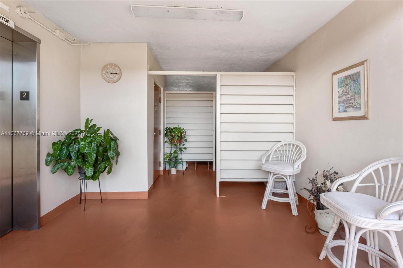 5300 Washington Street, Unit C111 Hollywood, FL 33021 - Photo 38 of 40 a view of a livingroom with furniture and a potted plant