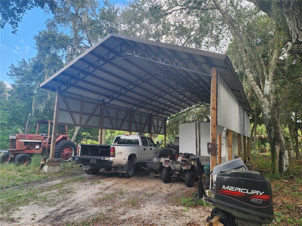 3945 County Road 833 Clewiston, FL 33440 - Photo 11 of 12 a view of a car park in front of house